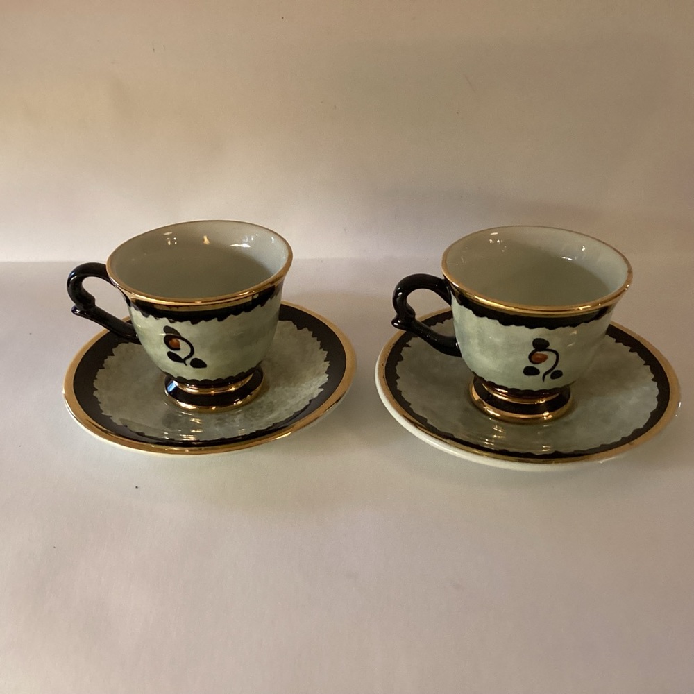 Vintage Demi tasse cups and saucers hand painted and signed.Made in Holland
